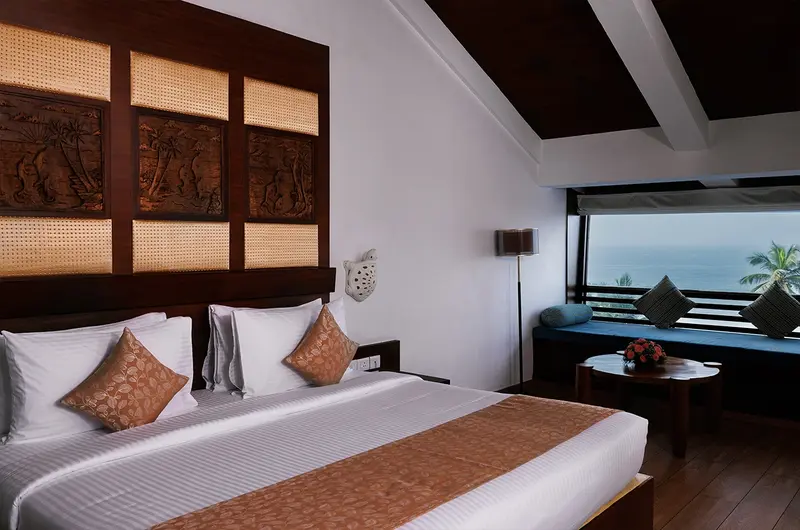 Modern ensuite bathroom featuring a luxury soaking tub at Gokulam Grand Turtle on the Beach Kovalam