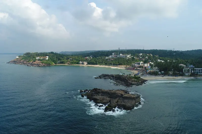 Scenic aerial view of Kovalam beach coastline and sea at Gokulam Grand Turtle on the Beach