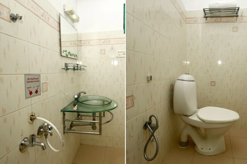 Modern ensuite bathroom layout and western toilet facilities at Hill and Sea View Ayurvedic Beach Resort