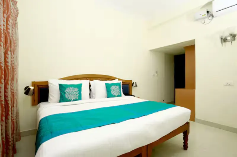 Standard AC double bedroom with minimalist decor at Hill and Sea View Ayurvedic Beach Resort