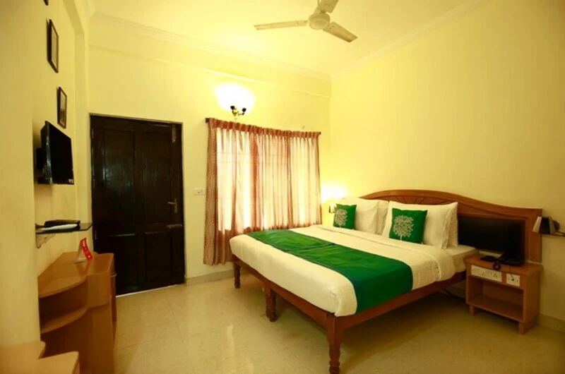 Cozy AC double room with warm ambient lighting at Hill and Sea View Ayurvedic Beach Resort Kovalam