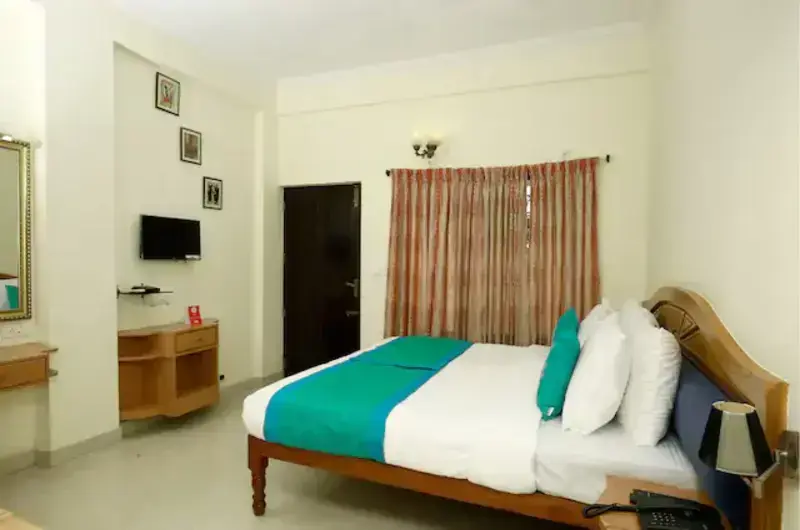Bright deluxe guest room accommodation with classic furnishings at Hill and Sea View Ayurvedic Beach Resort
