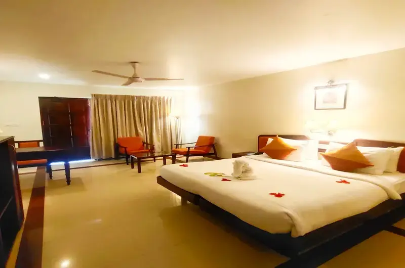 Luxury suite room accommodation with classic wooden furnishings at The Travancore Heritage Beach Resort