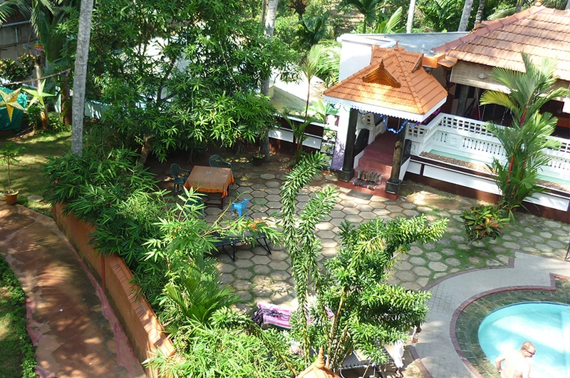 Beautifully landscaped garden path and outdoor greenery inside the Golden Sands Beach Resort premises.
