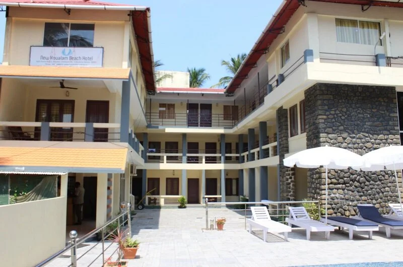 L-shaped modern building facade and central courtyard of New Kovalam Beach Hotel.