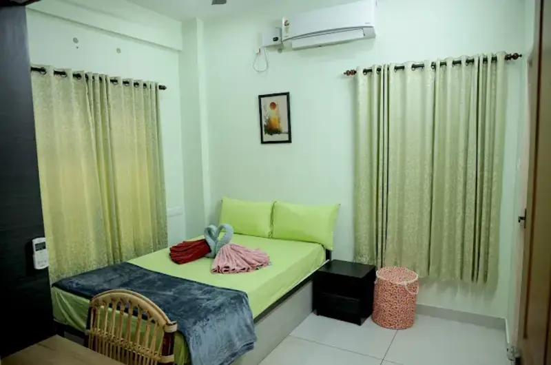 Spacious family suite room accommodation at The Nest Homestay Kovalam with multiple beds.