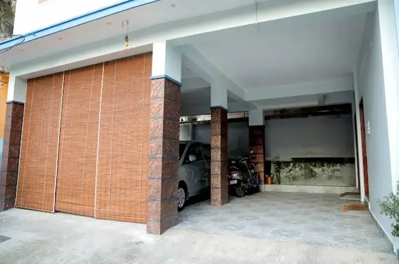 Secure covered car porch and front entrance area at The Nest Homestay Kovalam.
