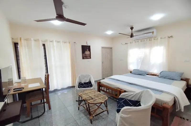 Welcoming common sitting lounge and family living room layout at Greenview Homestay Kovalam.