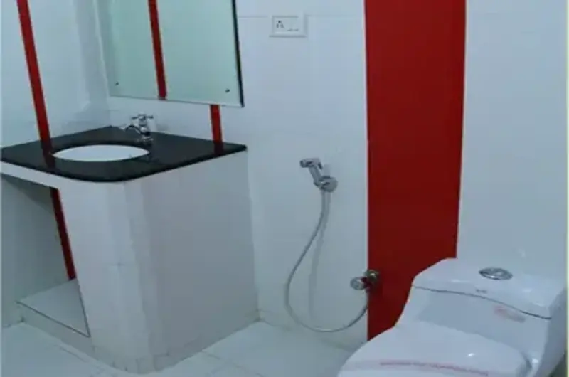 Clean and modern hotel bathroom washbasin setup at Rock N Beach Kovalam