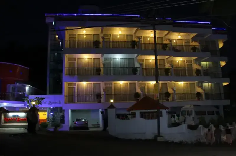 Rock N Beach hotel building exterior illuminated at night Kovalam