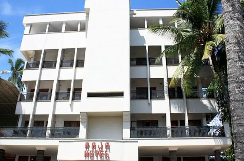 Raja Hotel multi story white building exterior view Kovalam