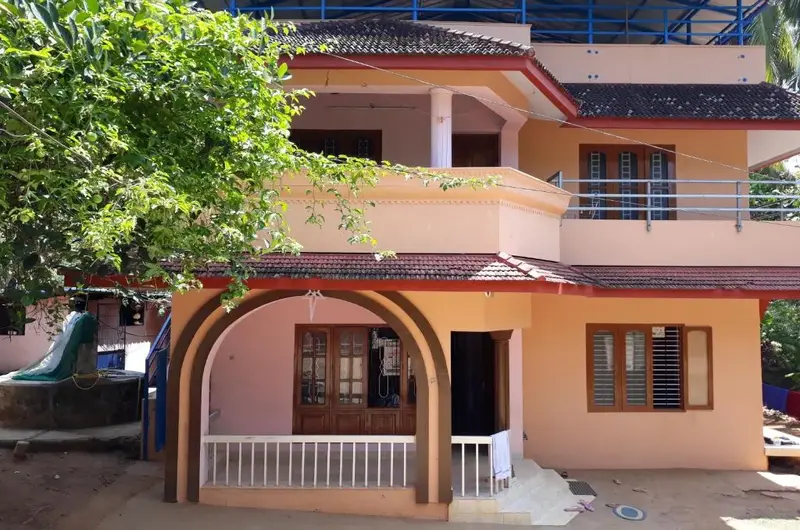 Padmini House multi story building exterior view with traditional gate Kovalam