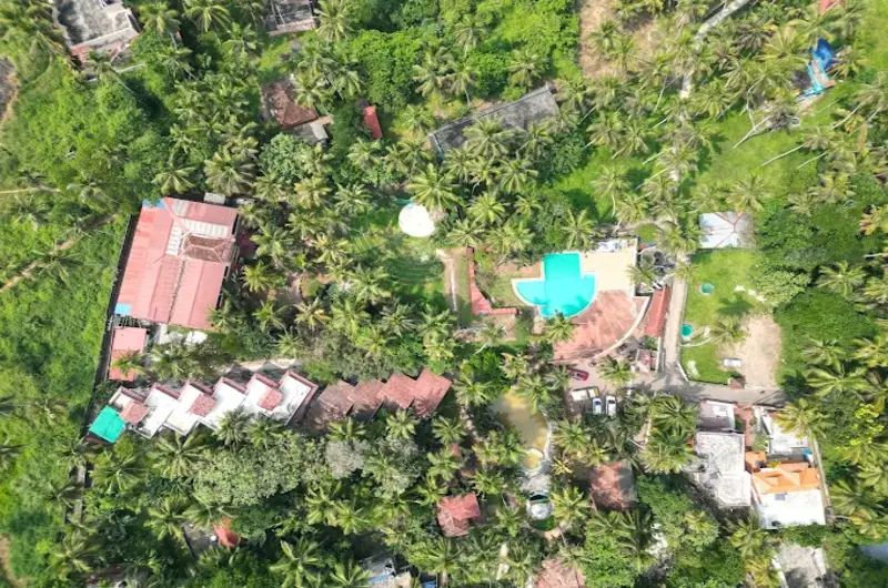 Country Club Kovalam Beach drone aerial view of resort property and swimming pool