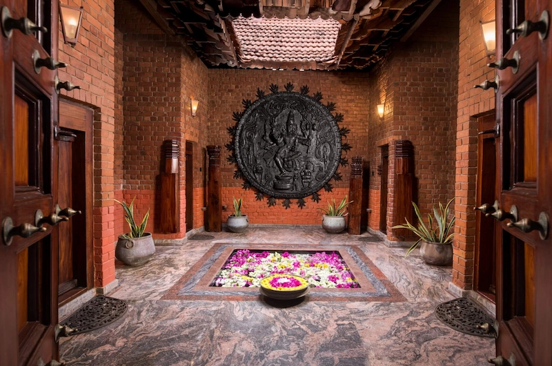 Interior courtyard with traditional Kerala brass lamp at Somatheeram Ayurvedic Health Resort