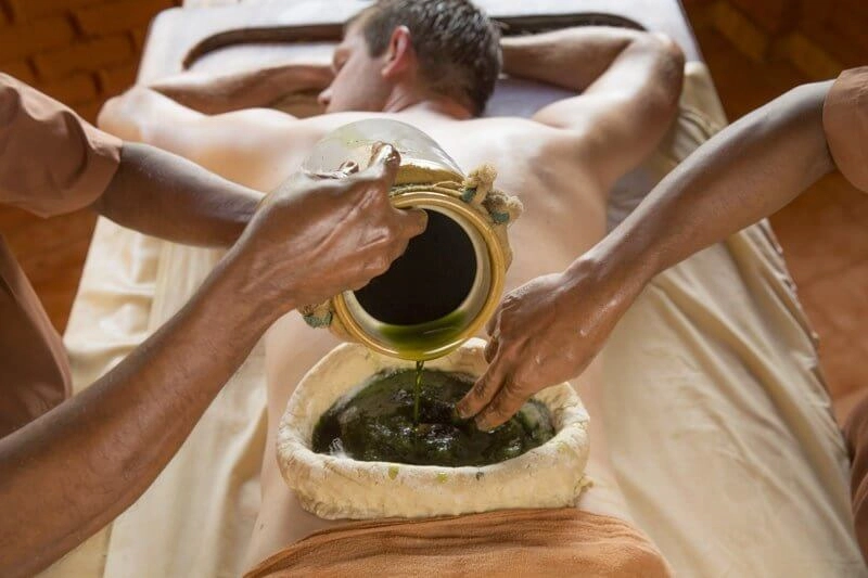 Traditional Ayurvedic oil massage treatment at Somatheeram Ayurvedic Health Resort Kovalam